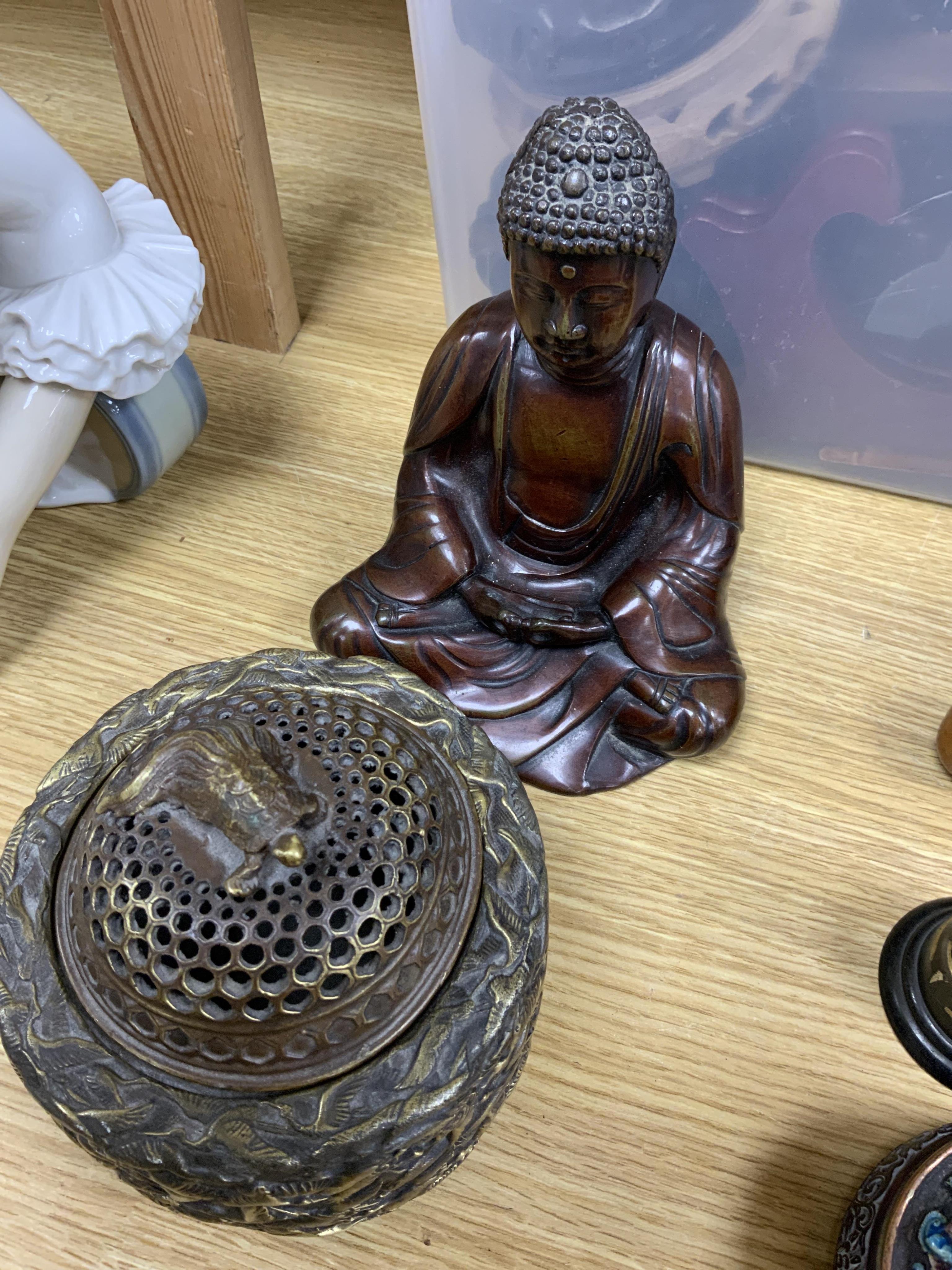 A quantity of Chinese bronzes and wood carvings including stands, seated Buddha etc.